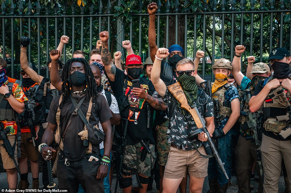 30399902-8490715-Demonstrators_fighting_for_Second_Amendment_rights_on_Saturday_g-a-57_1593922765138.jpg