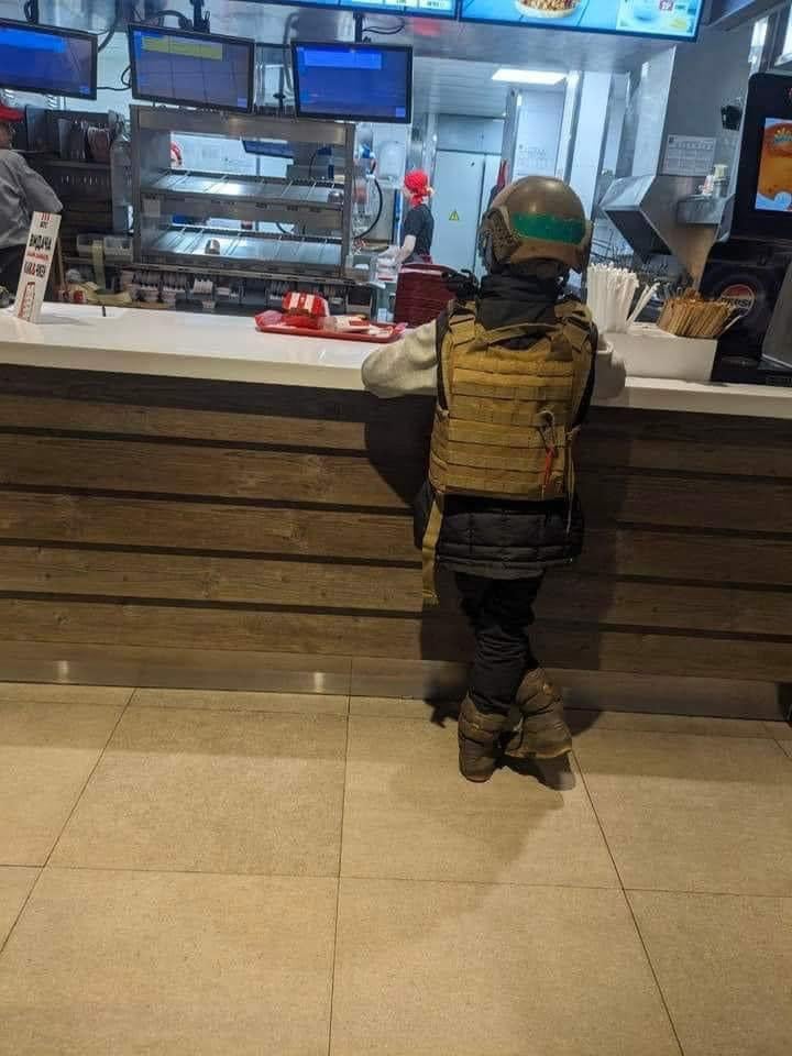 kharkiv-ukraine-kid-in-a-bulletproof-vest-waiting-for-his-v0-o9lv37kmdqwc1.jpeg
